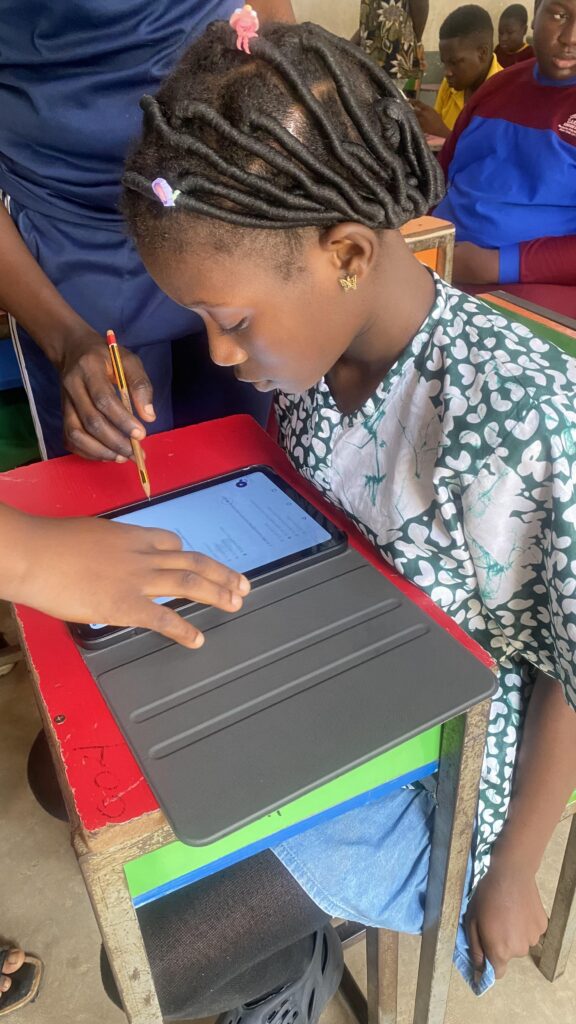A female student with a tablet in her front having tech examination in a class room - EpeeTech Solution (Cardon Standard Schools)