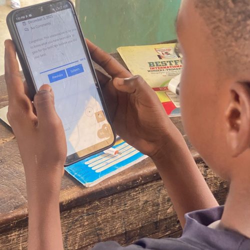 First term examination - student holding phone
