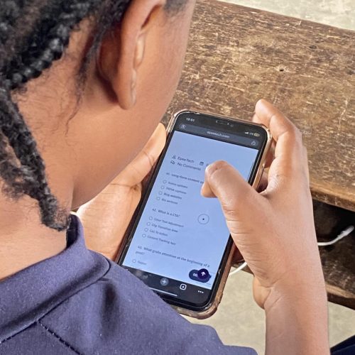 First term examination - student holding phone