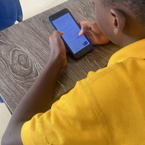 First term examination - student holding phone