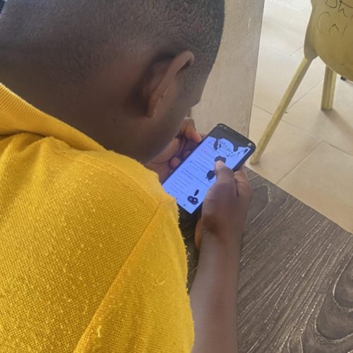 First term examination - student holding phone